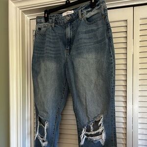 Very cute torn distressed jeans.